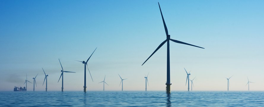 Photo by Nicholas Doherty on Unsplash -> windmolens in water