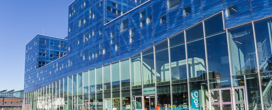 GRONINGEN, NETHERLANDS - FEBRUARY 15, 2019: Students enjoying the sun at the Groningen university campus