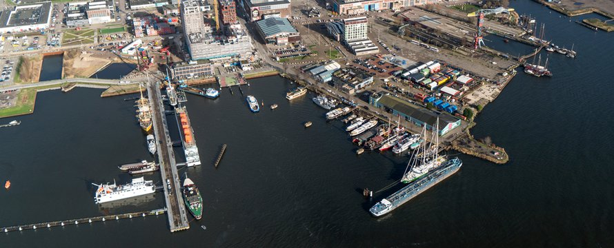 5 February 2020, Amsterdam Holland. Aerial view of NDSM wharf at the northside of river IJ. A harbour area with hotel, restaurant, residential apartments and construction of new high rise building.