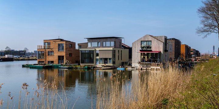 Amsterdam, April 2020. Neighborhood with wooden houses, floating on the water