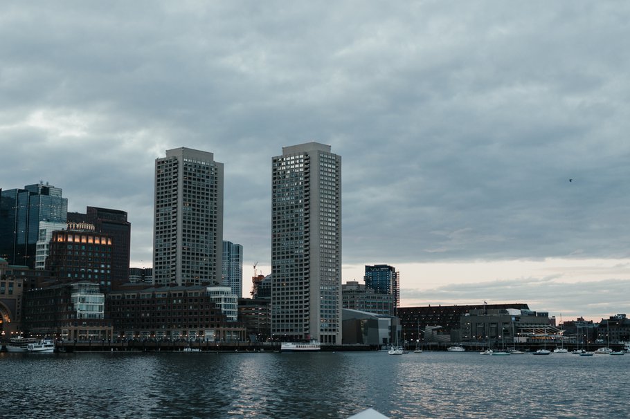 Cityscape over water on a cloudy day